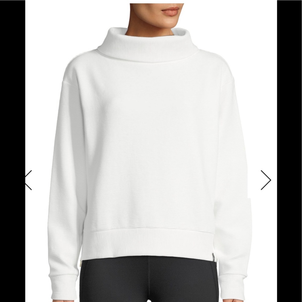 White sweater with gold zipper detailing
